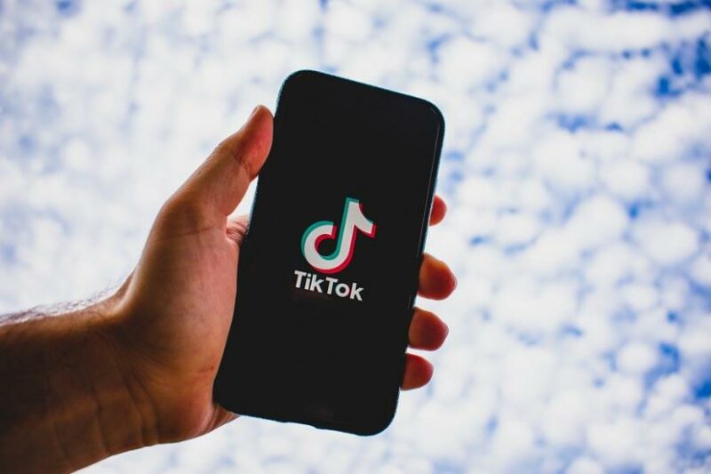 People Using Tiktok Application on Smartphone for Doing How to Make TikTok Videos